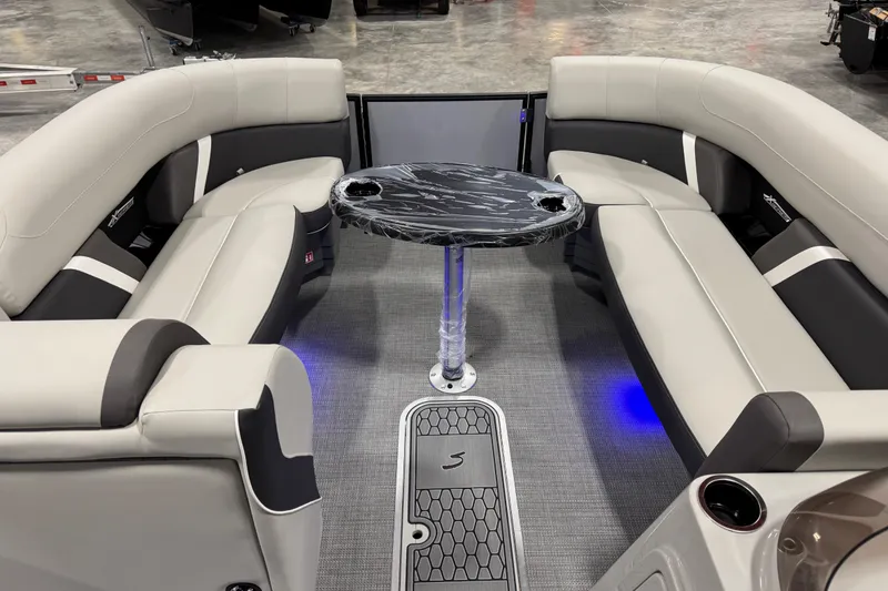 Slide: The Image of Luxurious interior of 2026 Sylvan X5 boat with plush seating and modern table. - 11