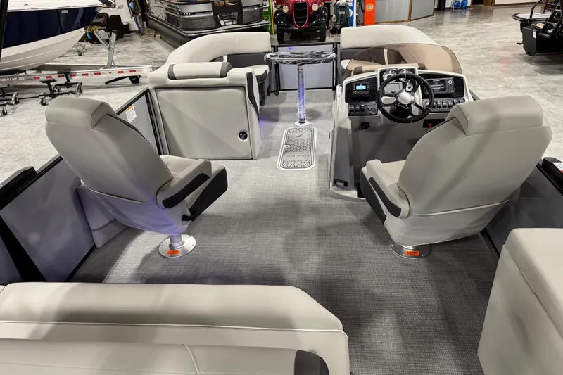 Slide: The Image of Interior of 2026 Sylvan X5 boat with modern seating and steering console. - 8