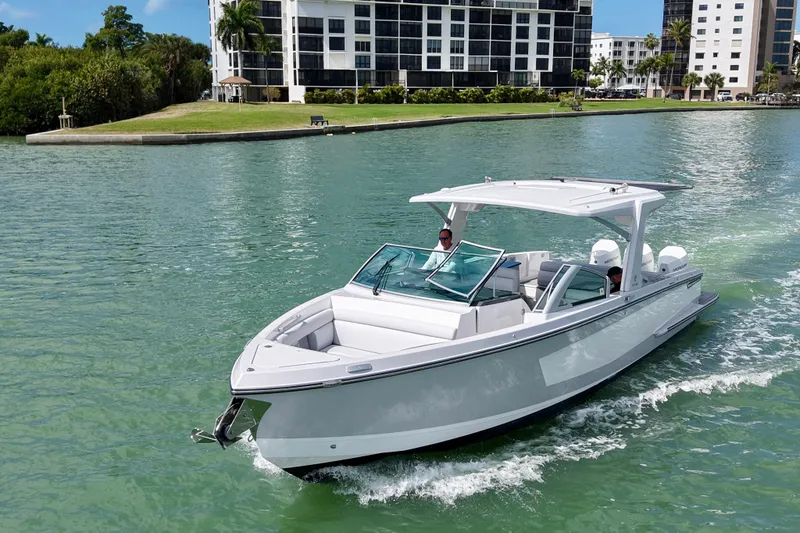 Slide: The Image of 2023 Aviara AV36 OB boat electrical panel with safety warnings and shore power connections. - 19