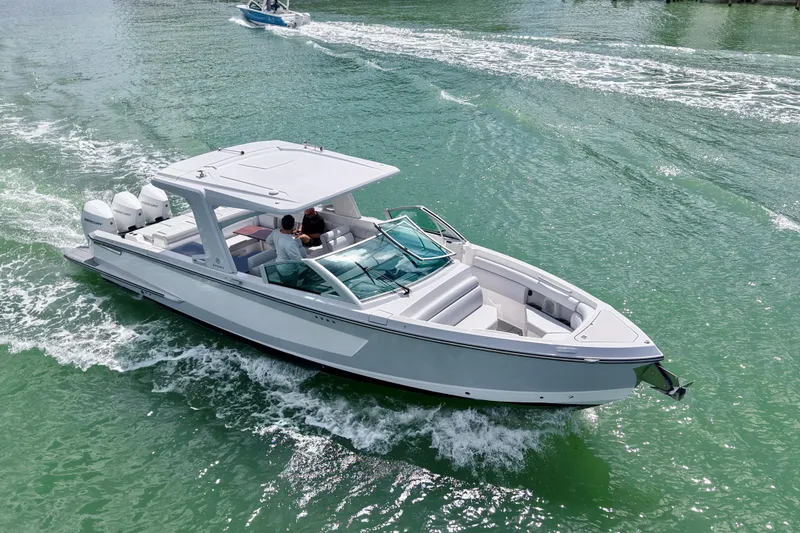 Slide: The Image of Luxurious seating area on 2023 Aviara AV36 OB boat with elegant wooden table. - 25