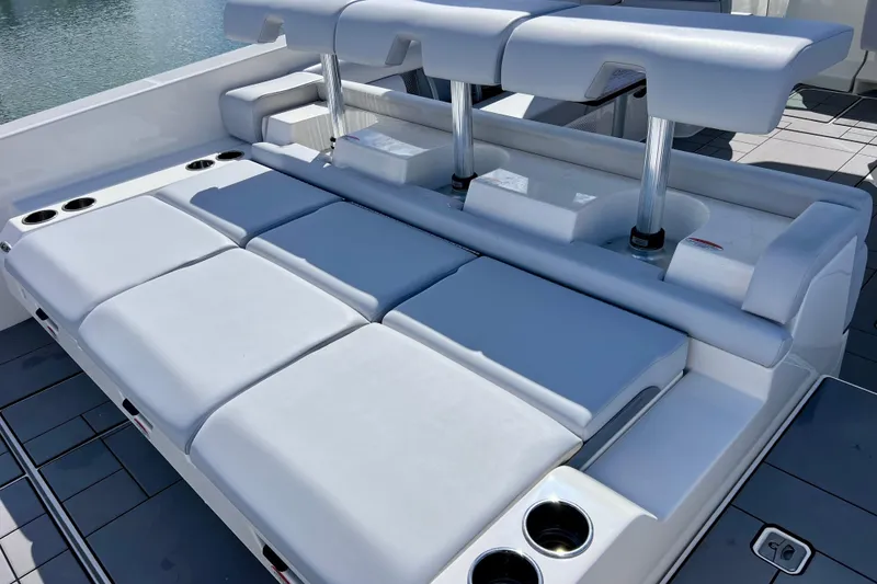 Slide: The Image of Man opening storage compartment on 2023 Aviara AV36 OB boat deck. - 38