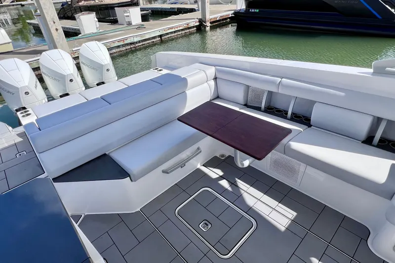 Slide: The Image of 2023 Aviara AV36 OB boat interior with vented panel and cushioned seating. - 40