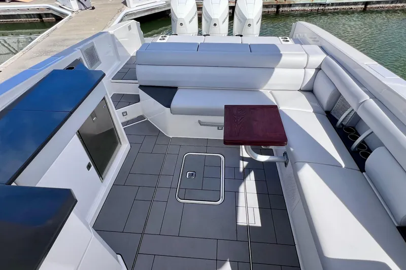 Slide: The Image of Steering wheel and dashboard of 2023 Aviara AV36 OB boat with navigation screens. - 44