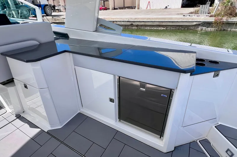 Slide: The Image of 2023 Aviara AV36 OB boat controls with joystick and throttle lever. - 45