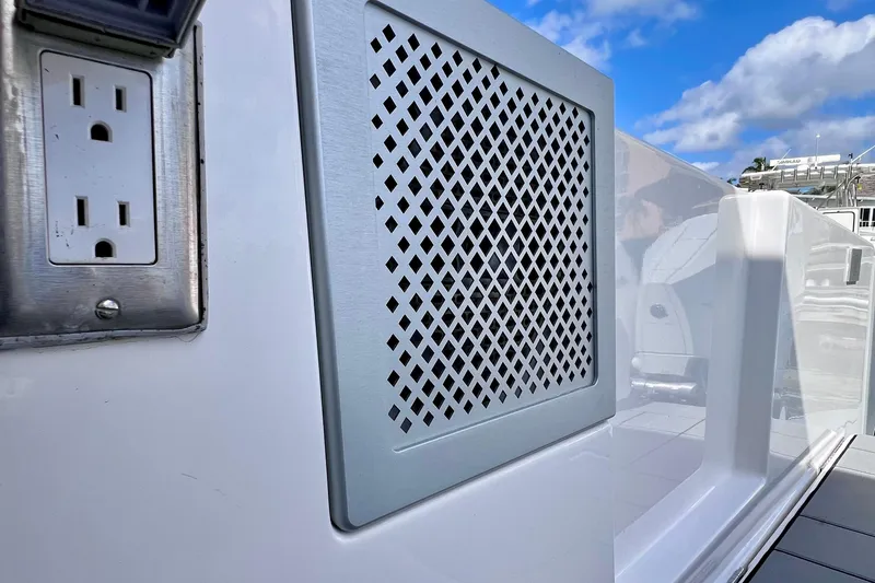 Slide: The Image of 2023 Aviara AV36 OB boat controls with start/stop button and joystick. - 46