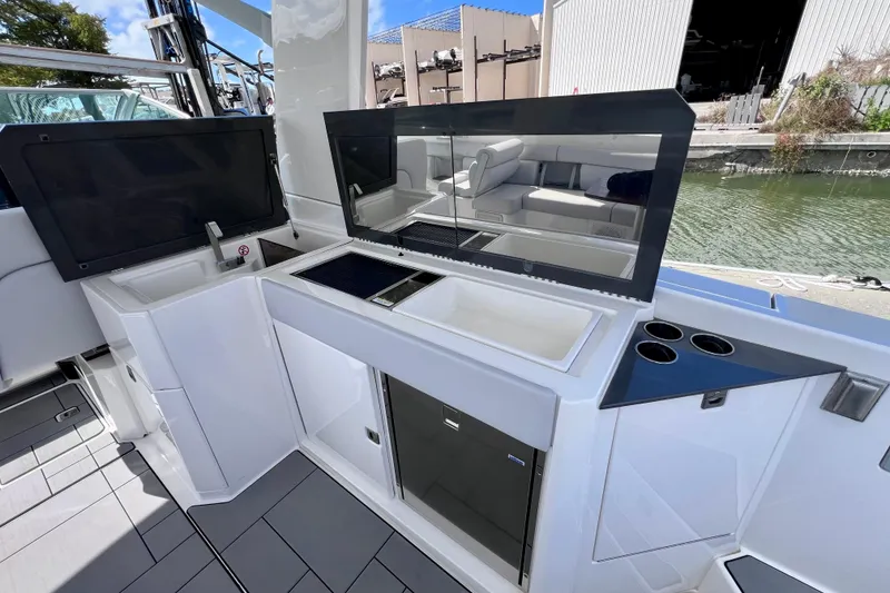 Slide: The Image of Simrad display on 2023 Aviara AV36 OB showing engine hours and fuel data. - 47