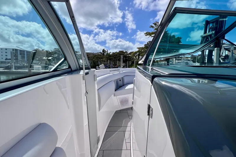 Slide: The Image of 2023 Aviara AV36 OB boat interior with sleek design and spacious seating under a blue sky. - 52