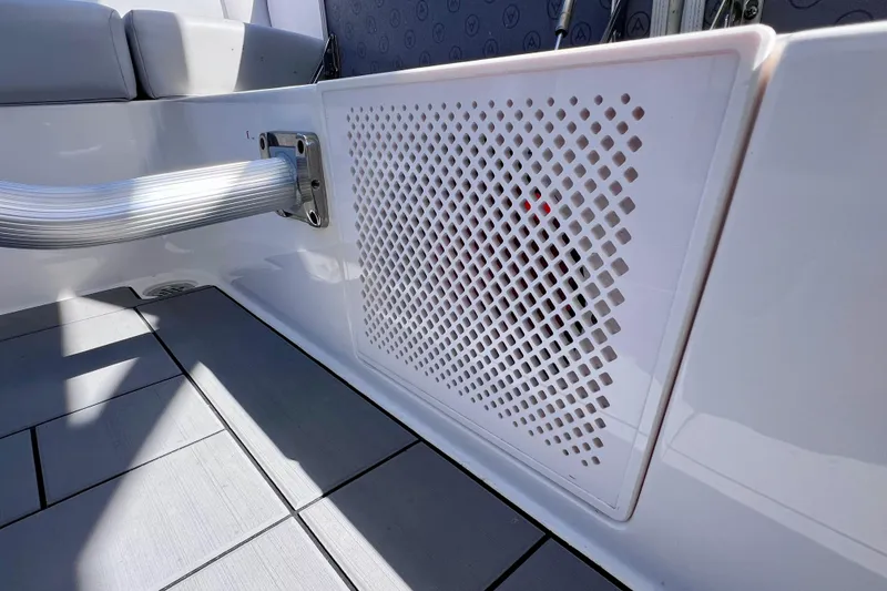 Slide: The Image of 2023 Aviara AV36 OB boat with open storage compartment under cushioned seating. - 57