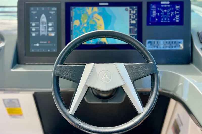 Slide: The Image of 2023 Aviara AV36 OB boat dashboard with modern controls and sleek design. - 61