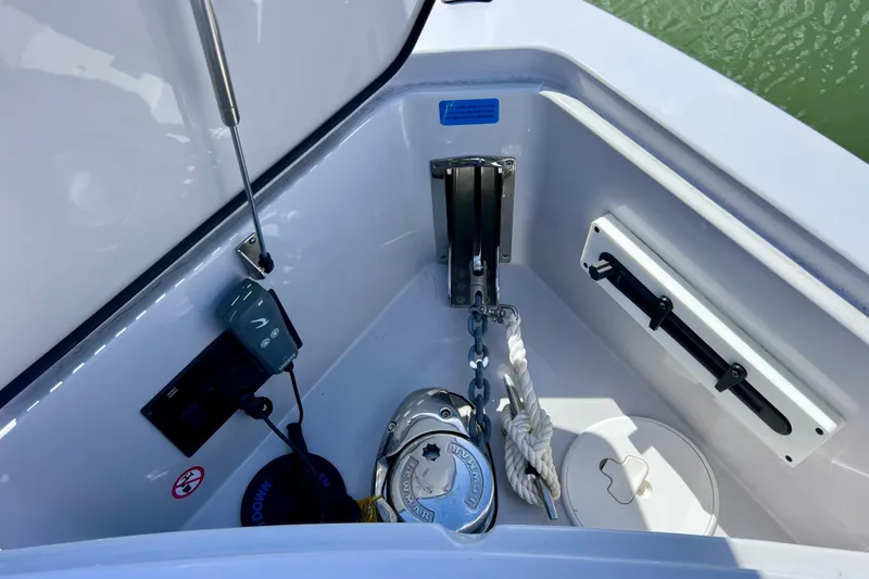 Slide: The Image of 2023 Aviara AV36 OB engine compartment with red EFI engine and wiring. - 76