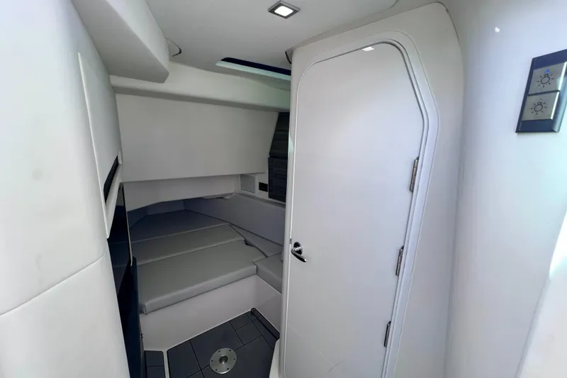 Slide: The Image of Simrad navigation display on 2023 Aviara AV36 OB, showing nautical map and autopilot settings. - 80