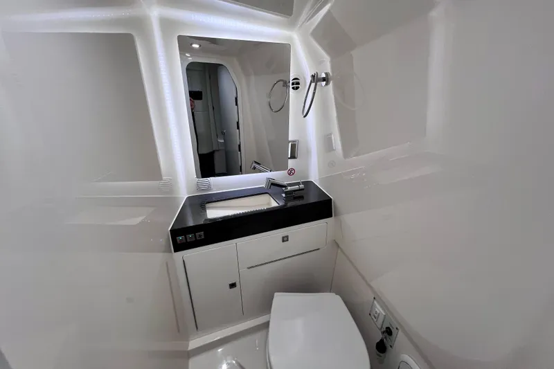 Slide: The Image of Simrad navigation display on 2023 Aviara AV36 OB, showing nautical map and vessel data. - 85