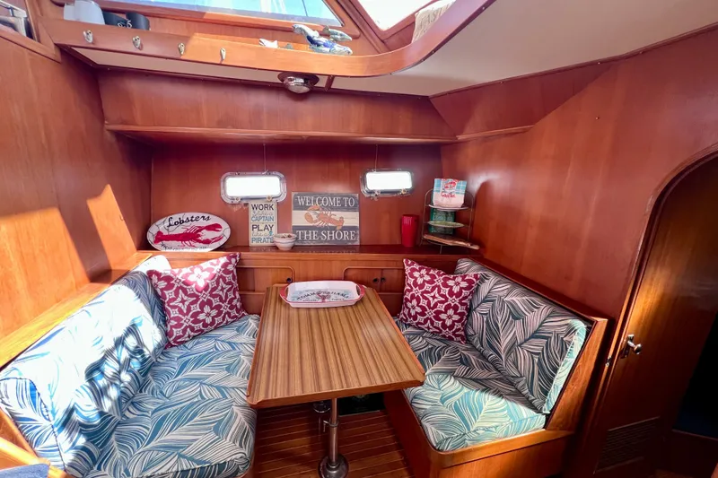 Slide: The Image of Cozy 1984 Kha Shing Spoiler yacht interior with nautical decor and wooden furnishings. - 10