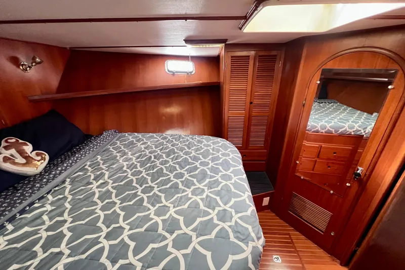 Slide: The Image of Luxurious 1984 Kha Shing Spoiler yacht cabin with cozy bed and elegant wood finish. - 13