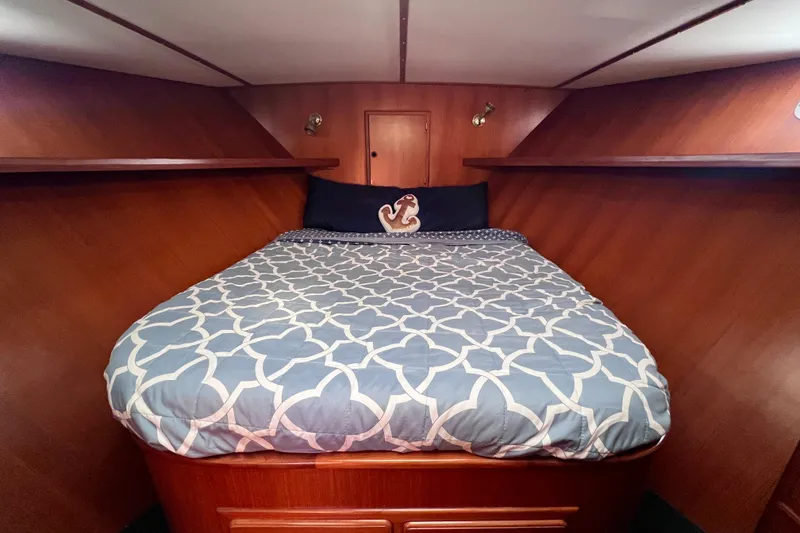 Slide: The Image of 1984 Kha Shing Spoiler yacht cabin with cozy bed and elegant wood paneling. - 14