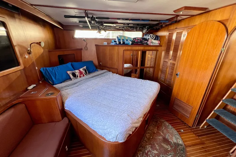 Slide: The Image of Cozy bedroom in 1984 Kha Shing Spoiler Cockpit Motor Yacht with wooden interior and double bed. - 16
