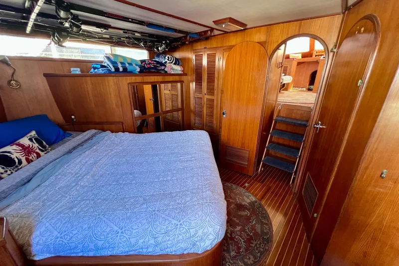 Slide: The Image of 1984 Kha Shing Spoiler yacht interior with cozy bedroom and wooden decor. - 17