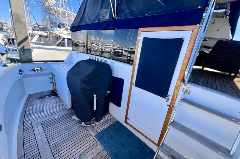 Slide: The Image of 1984 Kha Shing Spoiler Cockpit Motor Yacht with teak deck and covered equipment. - 20