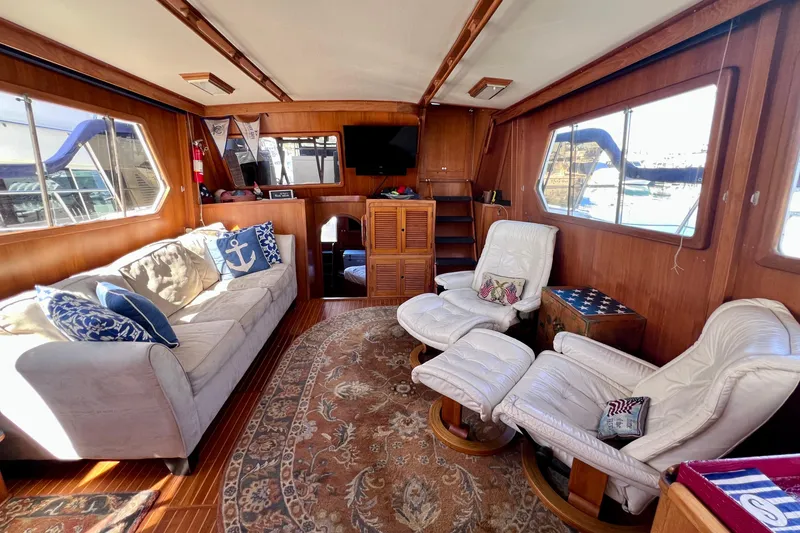 Slide: The Image of Luxurious 1984 Kha Shing Spoiler yacht interior with cozy seating and nautical decor. - 8