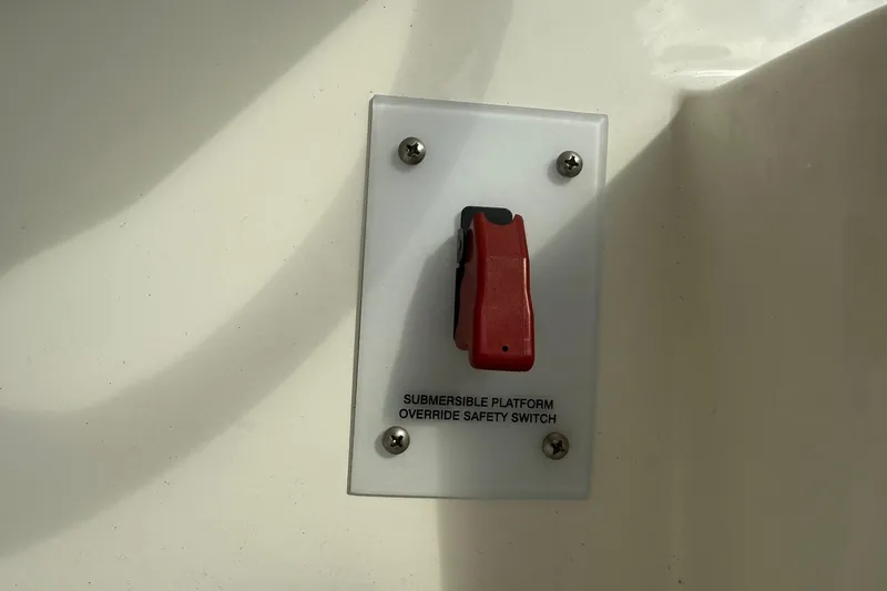 Slide: The Image of Submersible platform override safety switch on 2022 Sea Ray SPX 210 boat. - 11