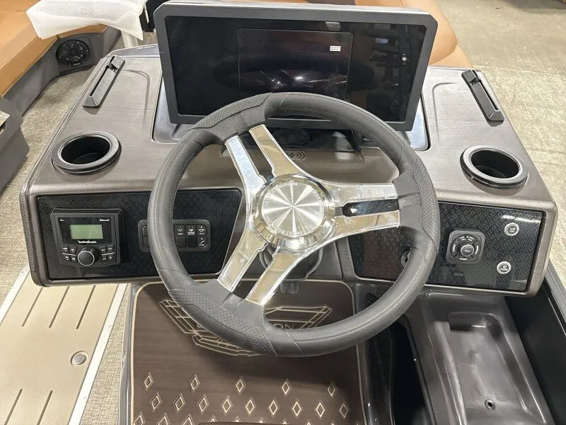 Slide: The Image of Steering wheel and dashboard of a 2026 Bennington 22MFB boat. - 10
