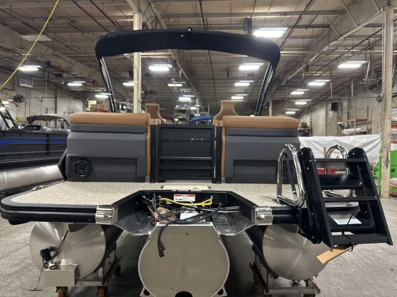 Slide: The Image of Bennington 22MFB 2026 pontoon boat in a factory setting. - 6