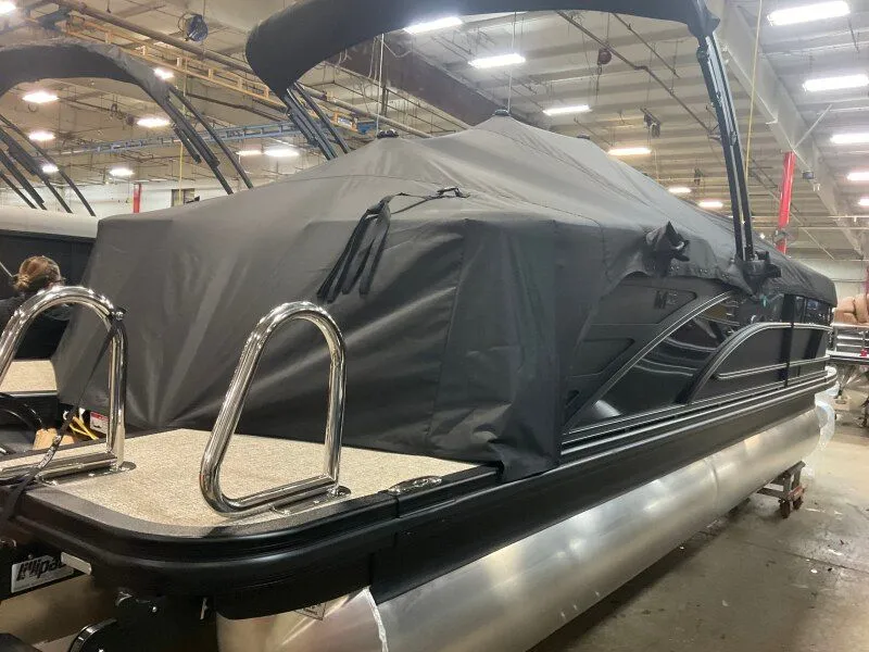 Slide: The Image of 2026 Bennington 22MFB pontoon boat in warehouse. - 9