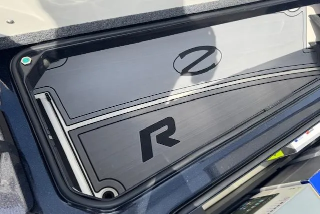 Slide: The Image of 2022 Ranger Z520R Cup-Equipped boat storage compartment with sleek design and logo detailing. - 14