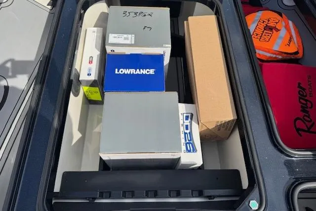 Slide: The Image of Storage compartment of 2022 Ranger Z520R Cup-Equipped boat with various equipment boxes. - 15