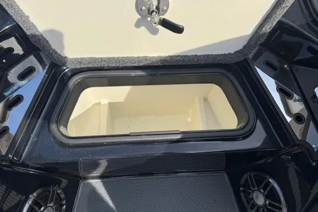 Slide: The Image of Open storage compartment in 2022 Ranger Z520R Cup-Equipped boat. - 18