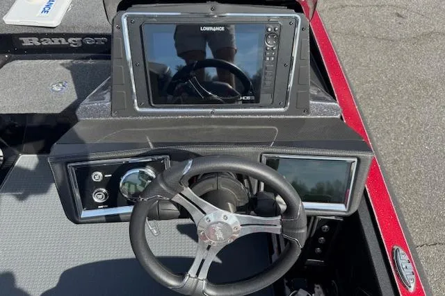 Slide: The Image of 2022 Ranger Z520R Cup-Equipped boat dashboard with steering wheel and Lowrance display. - 21