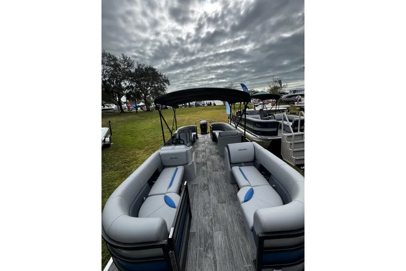 Slide: The Image of 2026 Bentley Pontoons Bolt 223 with spacious seating under cloudy skies. - 10