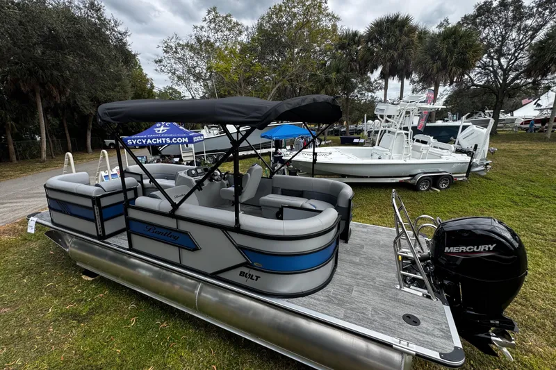 Slide: The Image of 2026 Bentley Pontoons Bolt 223 with Mercury engine displayed outdoors. - 9