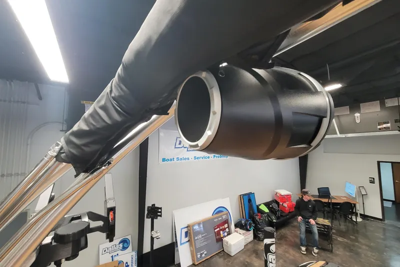 Slide: The Image of 2025 MasterCraft NXT23 boat speaker in showroom, highlighting audio system. - 13