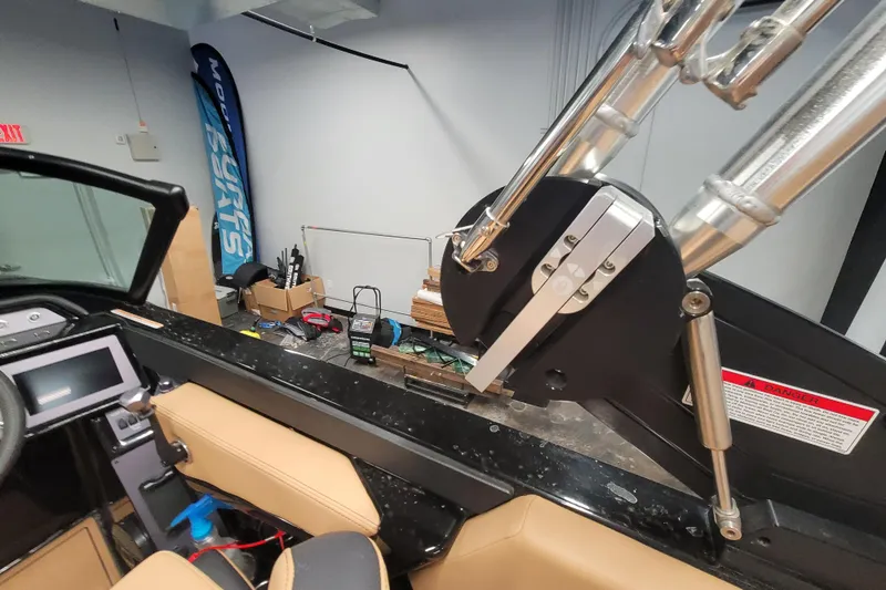 Slide: The Image of 2025 MasterCraft NXT23 boat interior with advanced control panel and sleek design elements. - 15