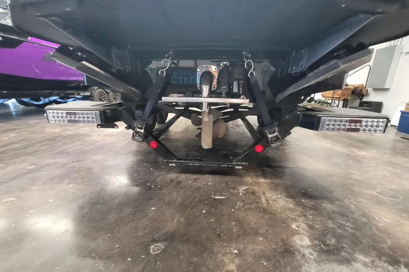 Slide: The Image of Rear view of 2025 MasterCraft NXT23 boat showing propeller and underwater gear. - 18