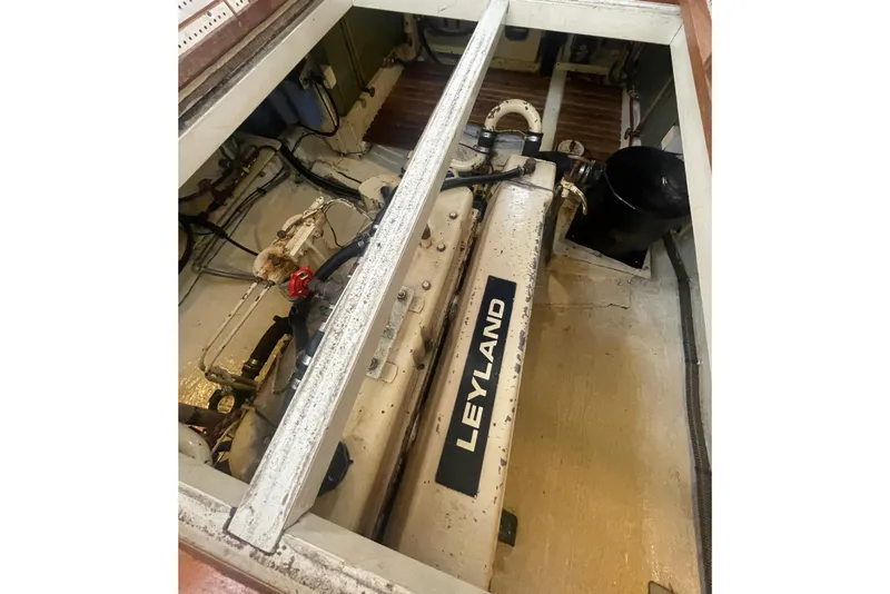 Slide: The Image of Engine compartment of 1984 Grand Banks 32 Sedan with Leyland engine visible. - 22