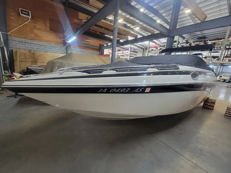 The Image of 2001 Crownline 230 boat in warehouse, side view. - 1