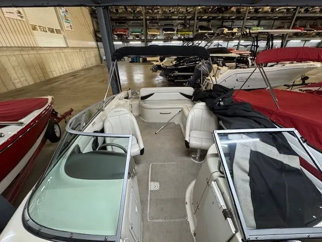 Slide: The Image of Interior view of a 2001 Crownline 230 boat in a storage facility. - 17