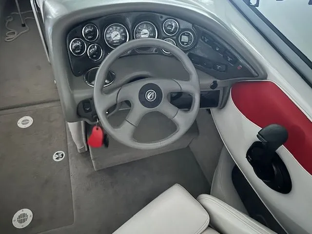 Slide: The Image of 2006 Crownline 266 boat dashboard with instruments. - 10