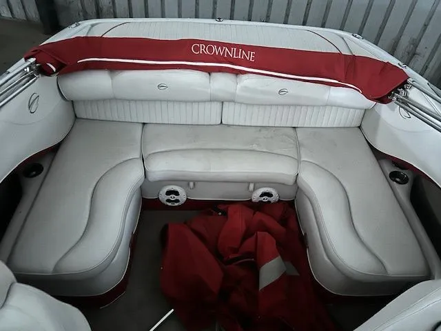 Slide: The Image of Interior of a 2006 Crownline 266 boat with white seating. - 12