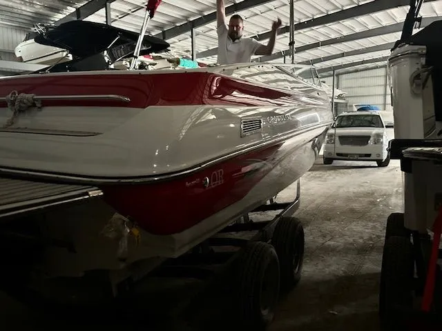 Slide: The Image of 2006 Crownline 266 boat in warehouse with person on board. - 14