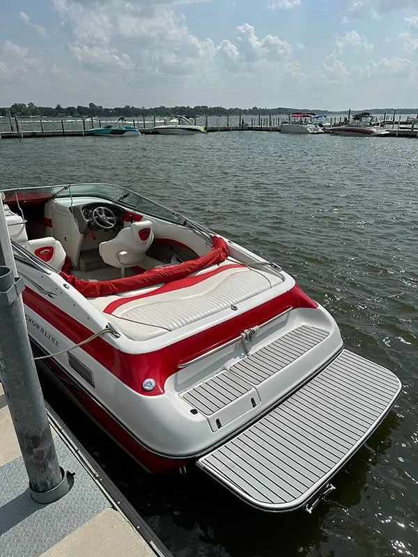 Slide: The Image of 2006 Crownline 266 boat docked on a sunny day. - 5