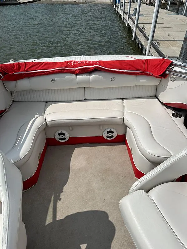 Slide: The Image of Interior of a 2006 Crownline 266 boat with white seating. - 7