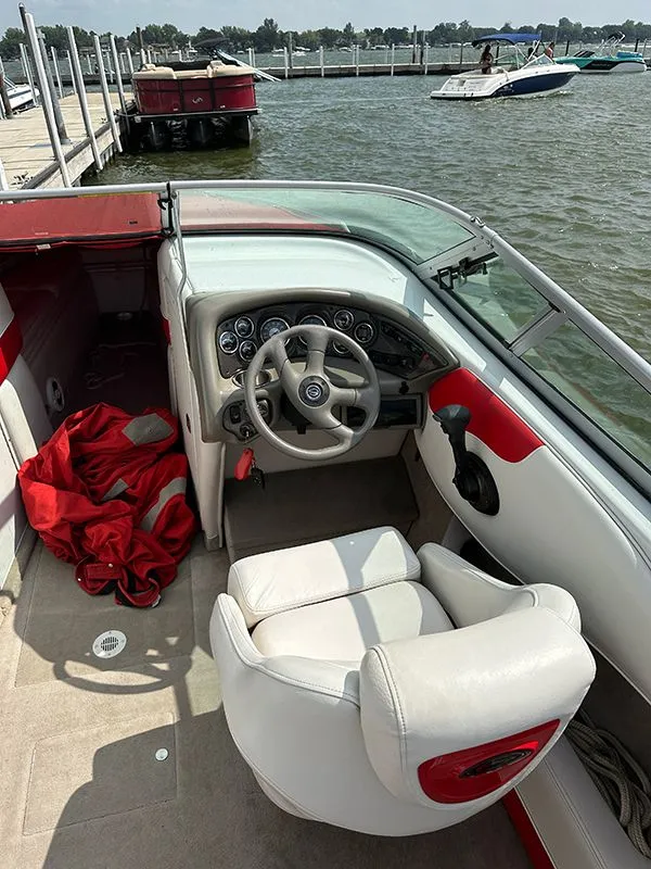 Slide: The Image of Interior of a 2006 Crownline 266 boat at the dock. - 8