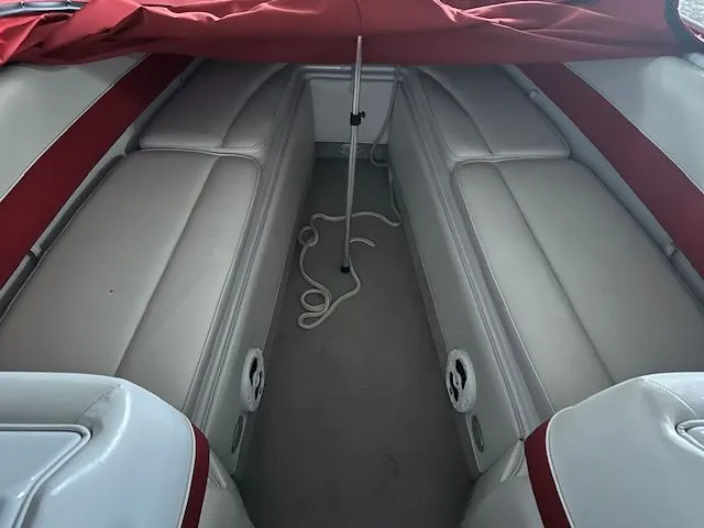 Slide: The Image of Interior of a 2006 Crownline 266 boat with red and white seating. - 9