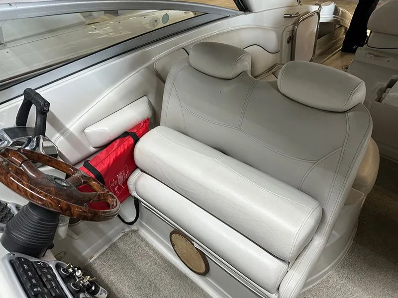 Slide: The Image of Interior of a 2005 Crownline 316 LS boat with steering wheel. - 4