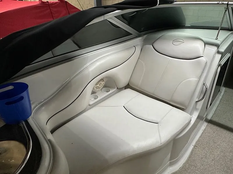 Slide: The Image of Interior of a 2005 Crownline 316 LS boat with white leather seating. - 5
