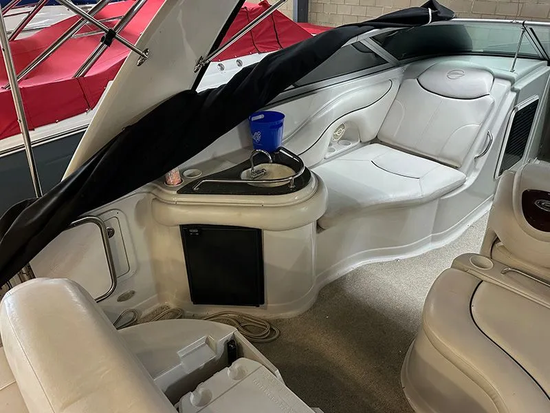 Slide: The Image of Interior of a 2005 Crownline 316 LS boat with white seating. - 9