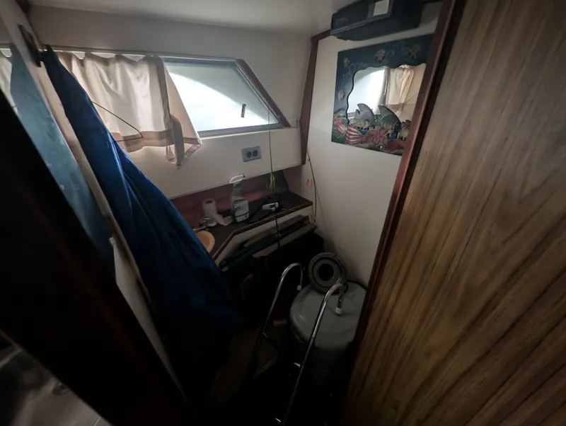 Slide: The Image of Interior of a 1976 Silverton 26' yacht with window and mirror. - 11